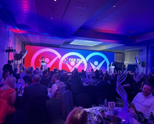 Woman speaking at the 2024 FAB Awards in Leicester